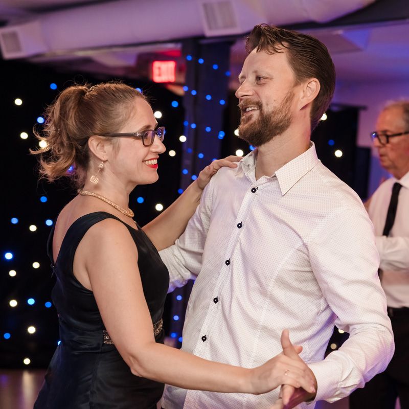 A couple dancing at a wedding reception, showcasing their ballroom skills in Gainesville, FL.
